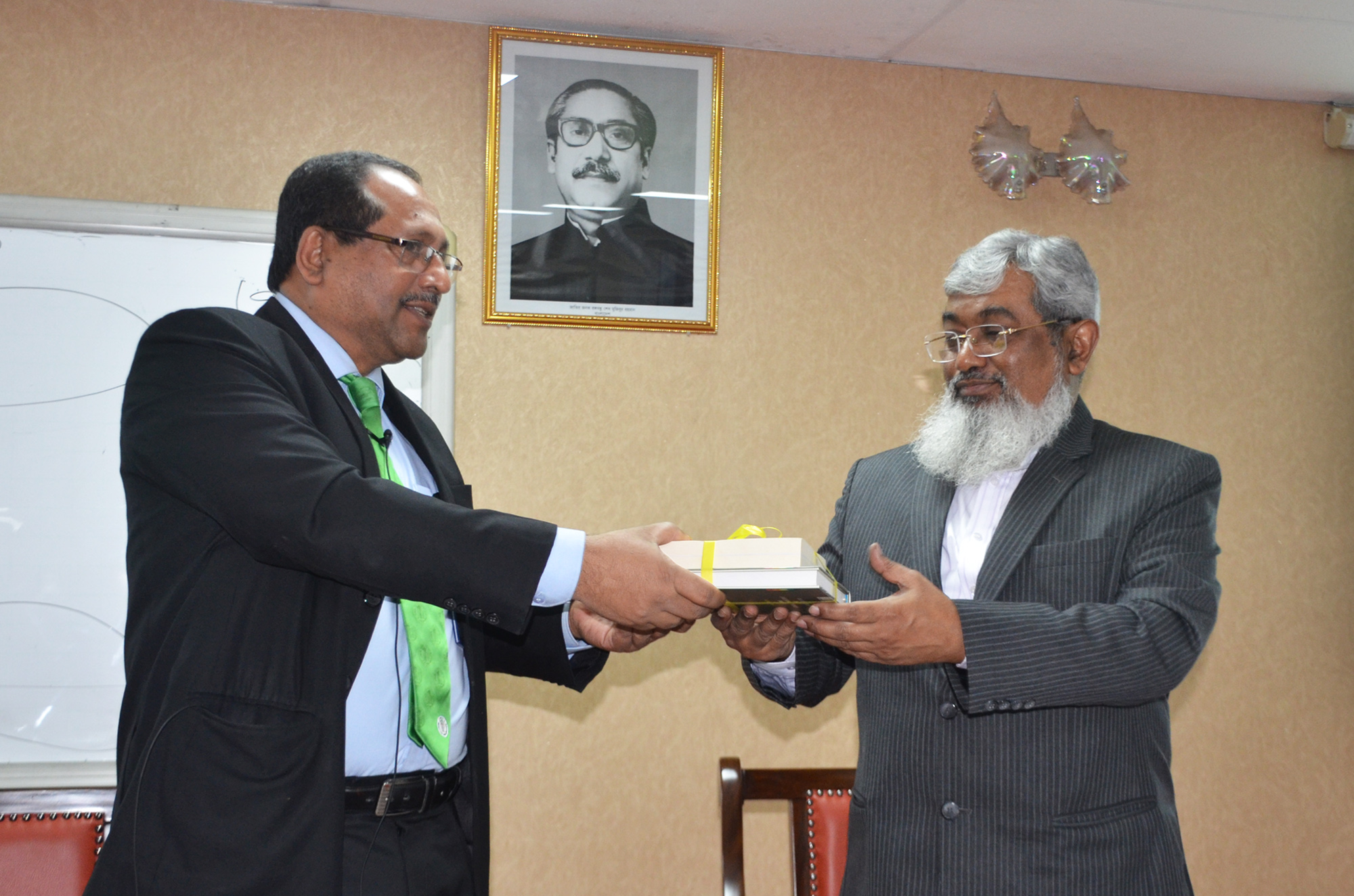 Cabinet Secretary Receiving Gift From Ractor of bpatc